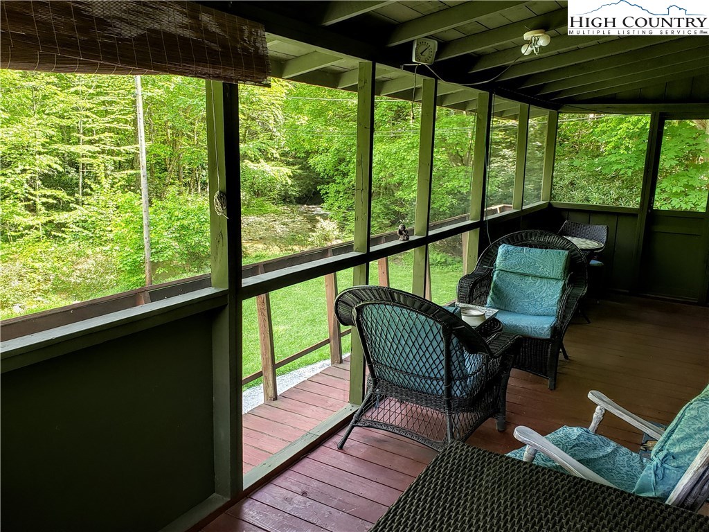 125 Creek Road Boone, NC 28607 - Photo 21 of 32 a view of a chairs and table in patio