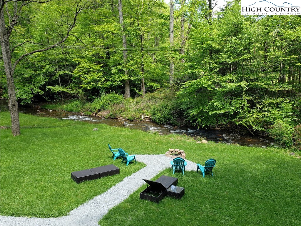 125 Creek Road Boone, NC 28607 - Photo 23 of 32 a view of a golf course with chairs