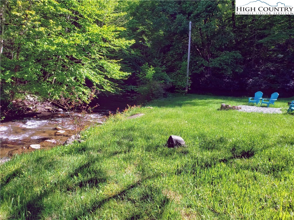 125 Creek Road Boone, NC 28607 - Photo 29 of 32 a view of a yard with plants