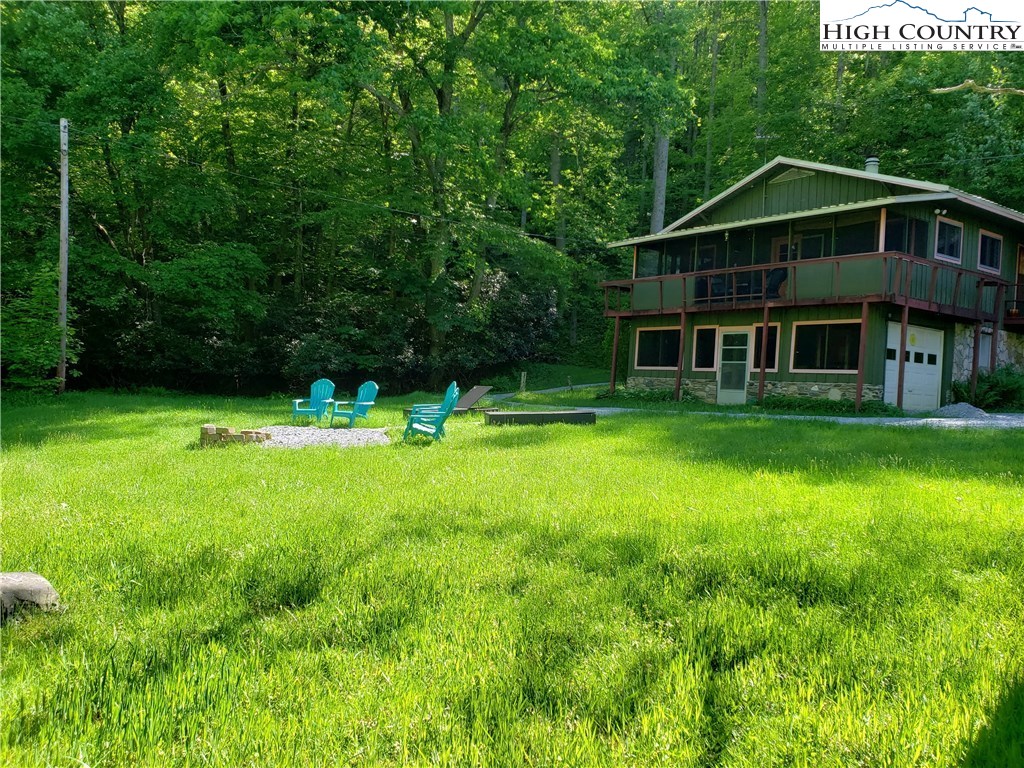 125 Creek Road Boone, NC 28607 - Photo 30 of 32 a view of a house with a yard