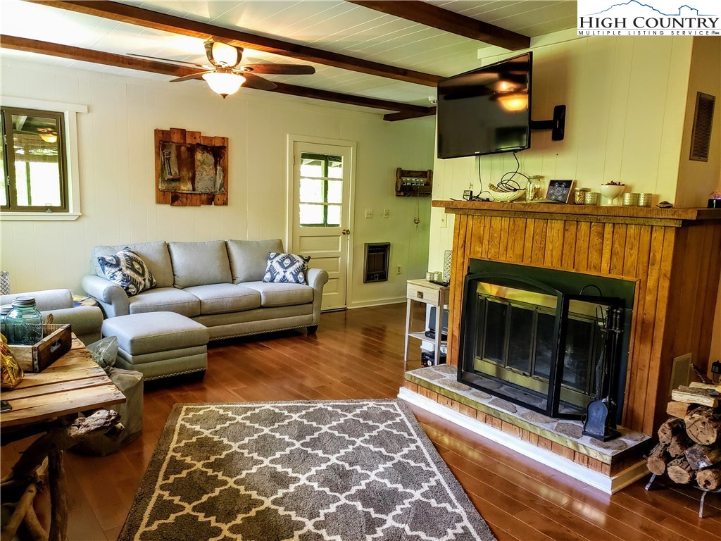 125 Creek Road Boone, NC 28607 - Photo 3 of 32 a living room with furniture and a fireplace