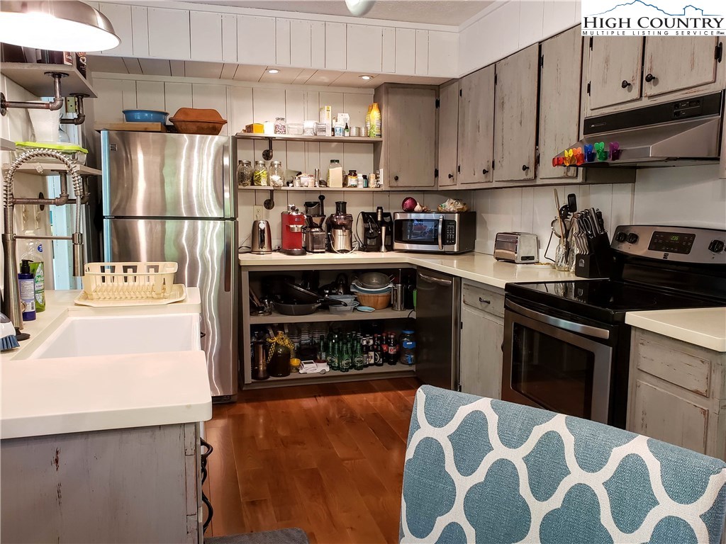 125 Creek Road Boone, NC 28607 - Photo 6 of 32 a kitchen with stainless steel appliances granite countertop a refrigerator and stove