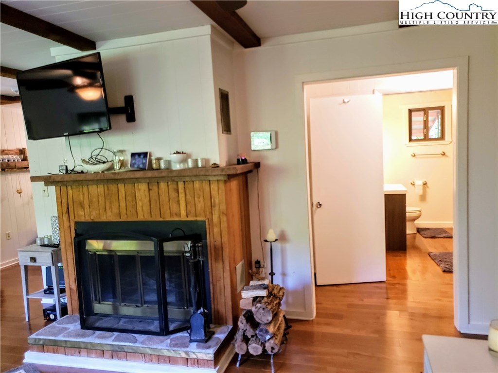 125 Creek Road Boone, NC 28607 - Photo 10 of 32 a living room with furniture and a fireplace