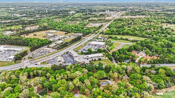an aerial view of residential houses with outdoor space and garden