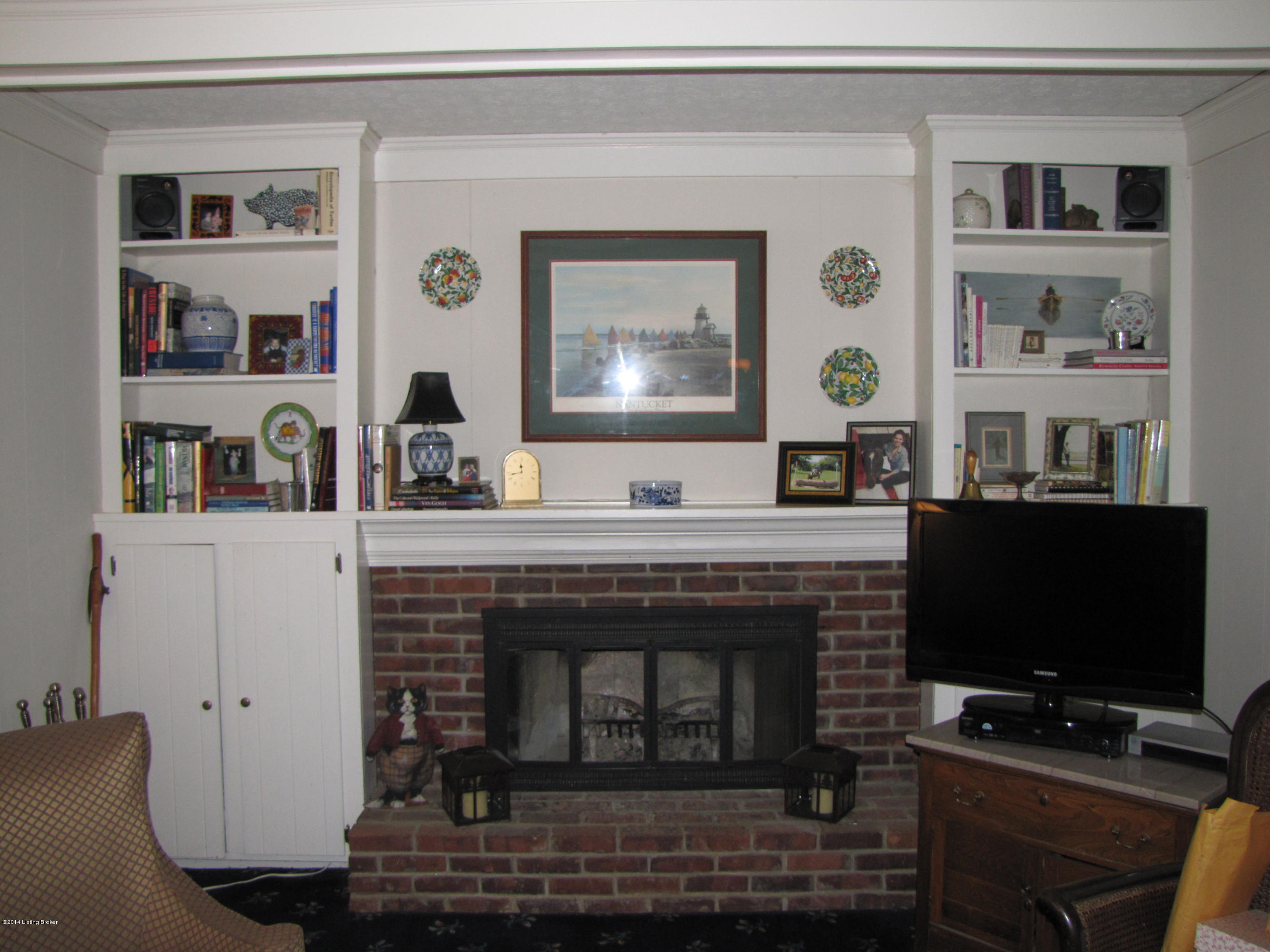 10710 Sun Ridge Road Goshen, KY 40026 - Photo 20 of 55 The fireplace is flanked by built-in bookshelves and cabinetry