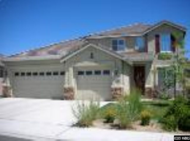 10070 Stonechase Court Reno, NV 89521 - Photo 1 of 9 a front view of a house with a yard