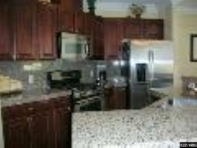 10070 Stonechase Court Reno, NV 89521 - Photo 2 of 9 a kitchen with lots of counter top space