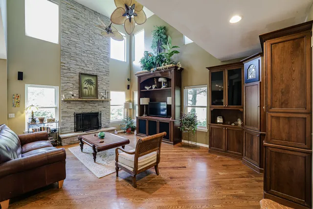 a living room with furniture fireplace and flat screen tv