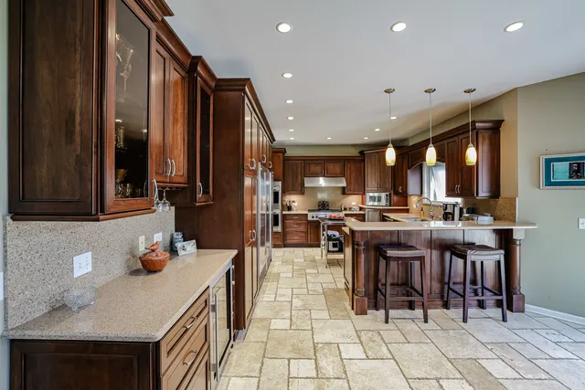 a kitchen with lots of counter top space and appliances