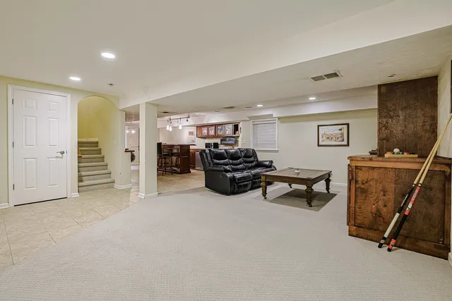 a room with furniture and gym equipment