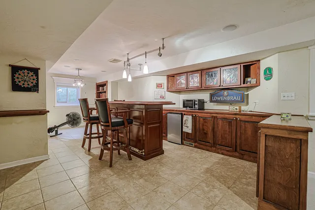 a kitchen with a cabinets and chairs