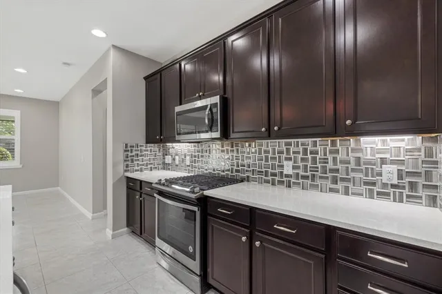 an aerial view of a house with a lake view