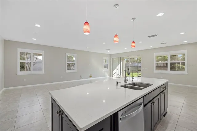 an aerial view of a house with a lake view