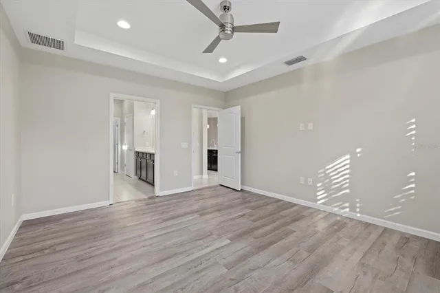 an aerial view of residential houses with outdoor space and swimming pool