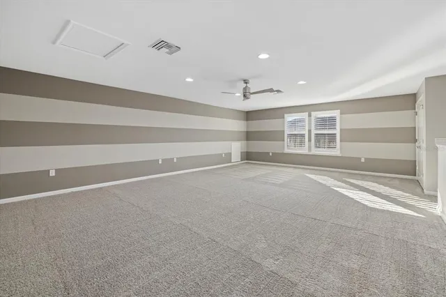 an aerial view of a house with garden space and outdoor seating