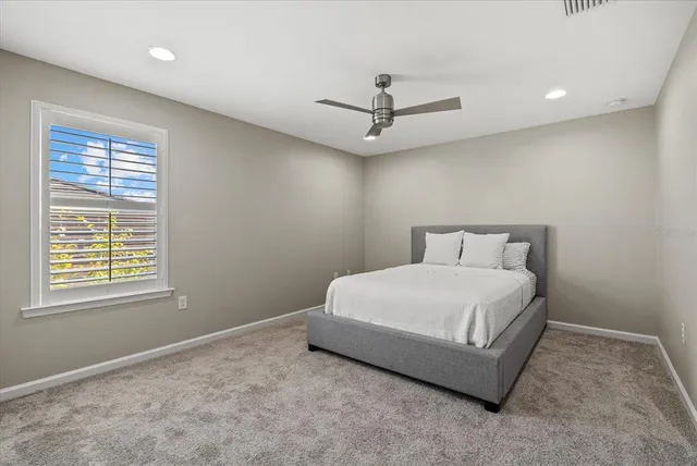 an aerial view of a house with outdoor space