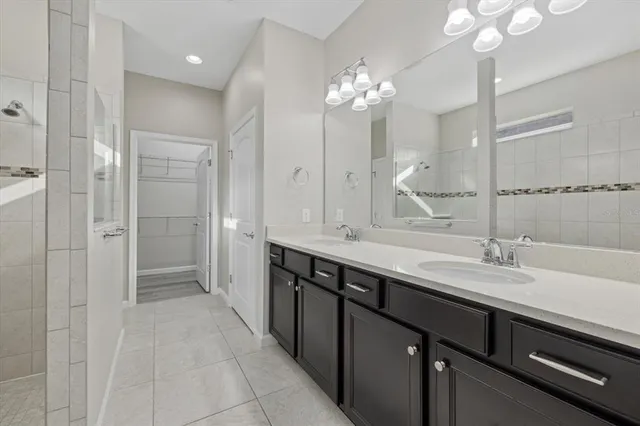 an aerial view of residential houses with outdoor space and swimming pool