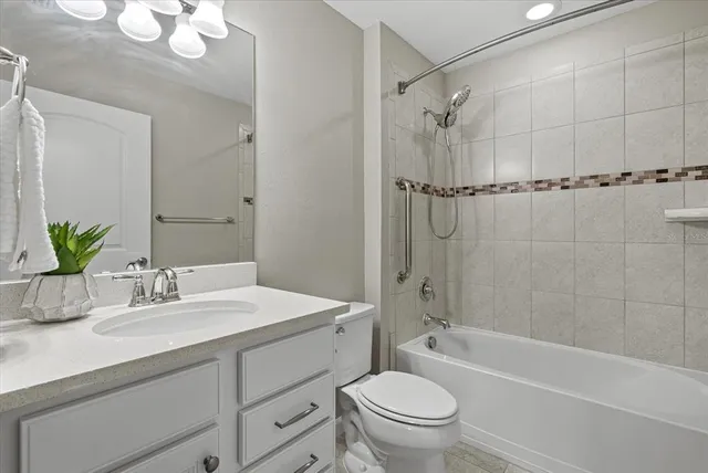 an aerial view of a house with a lake view