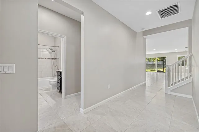 a view of an empty room with a bathroom