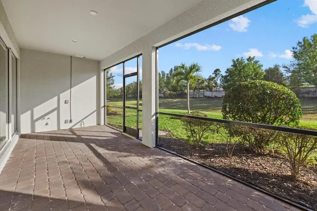 a swimming pool with outdoor seating and yard