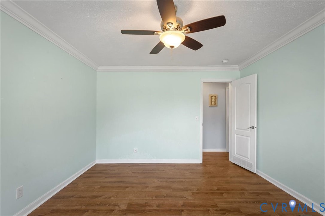 2181 Mill Quarter Road Ford, VA 23850 - Photo 27 of 56 Wood-finish flooring, crown molding, ceiling fan w