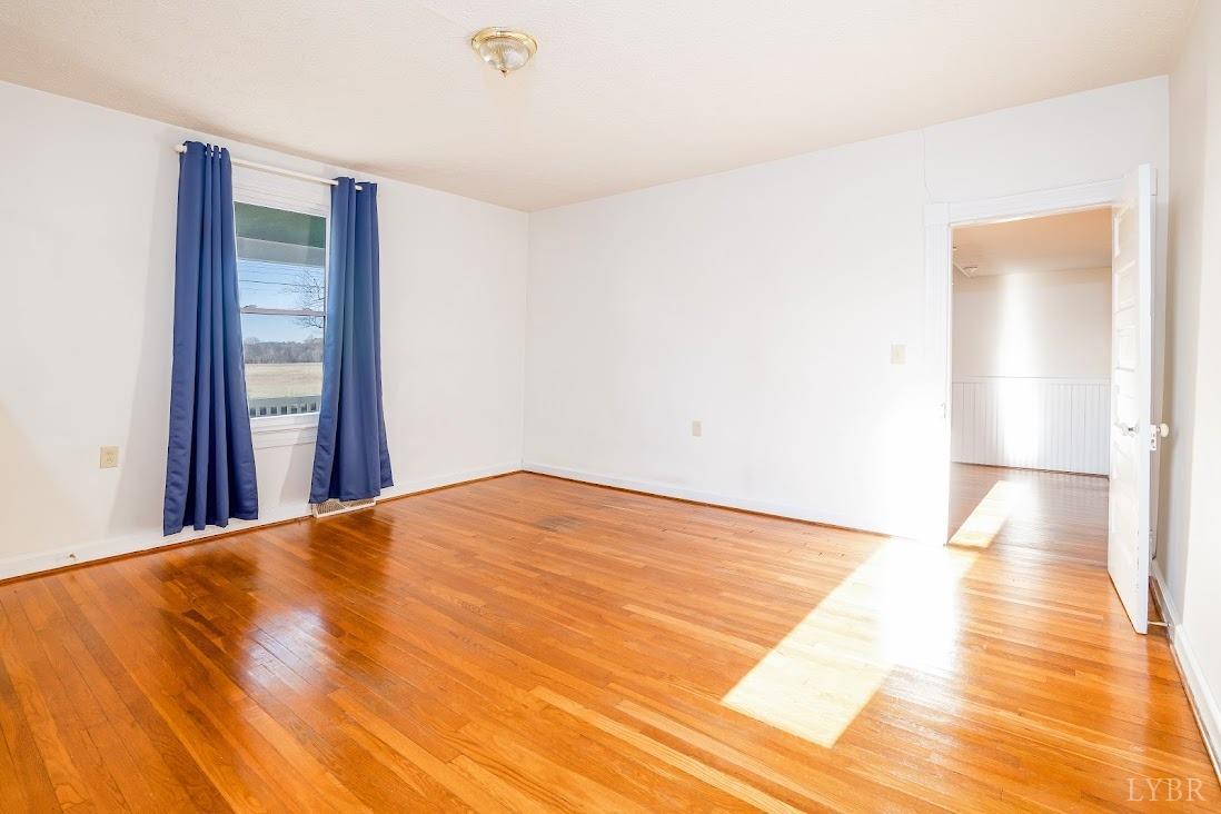 3655 Lowry Road Goode, VA 24556 - Photo 13 of 46 a view of a room with wooden floor and white walls