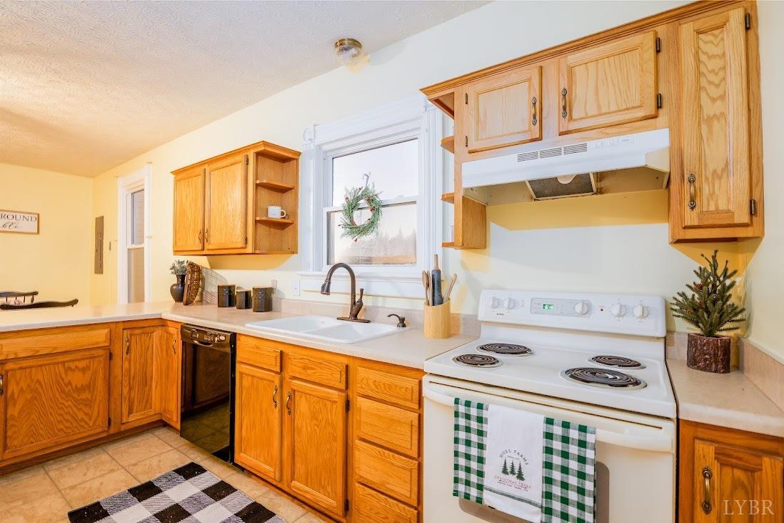 3655 Lowry Road Goode, VA 24556 - Photo 16 of 46 a kitchen with a sink stove and cabinets