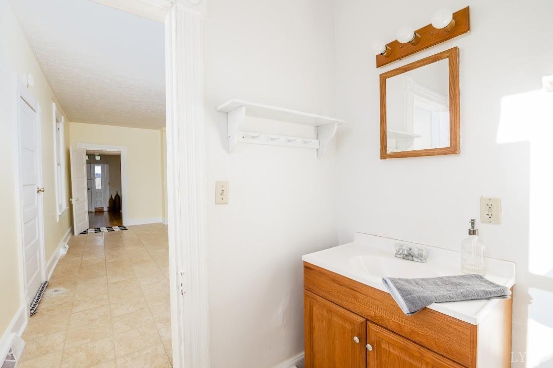 3655 Lowry Road Goode, VA 24556 - Photo 21 of 46 a bathroom with a sink and a mirror