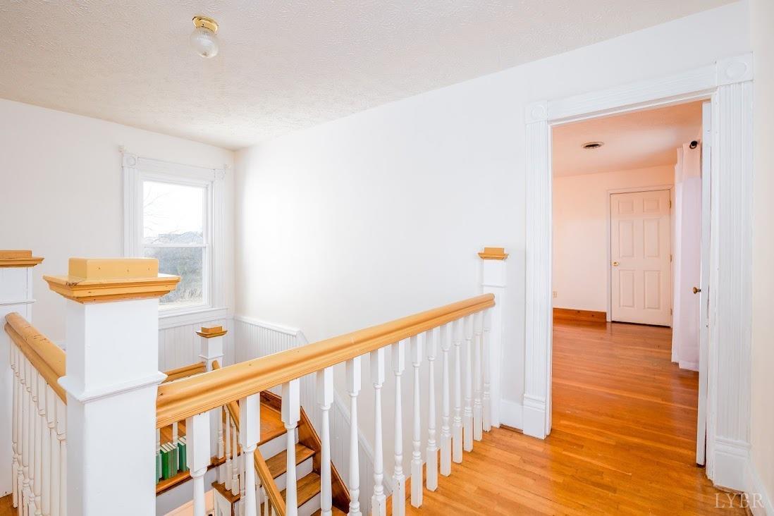 3655 Lowry Road Goode, VA 24556 - Photo 27 of 46 a view of a hallway with wooden floor and furniture