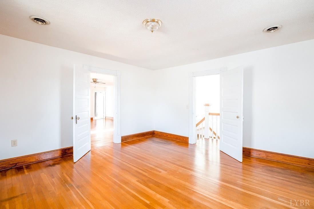 3655 Lowry Road Goode, VA 24556 - Photo 29 of 46 a view of empty room with wooden floor