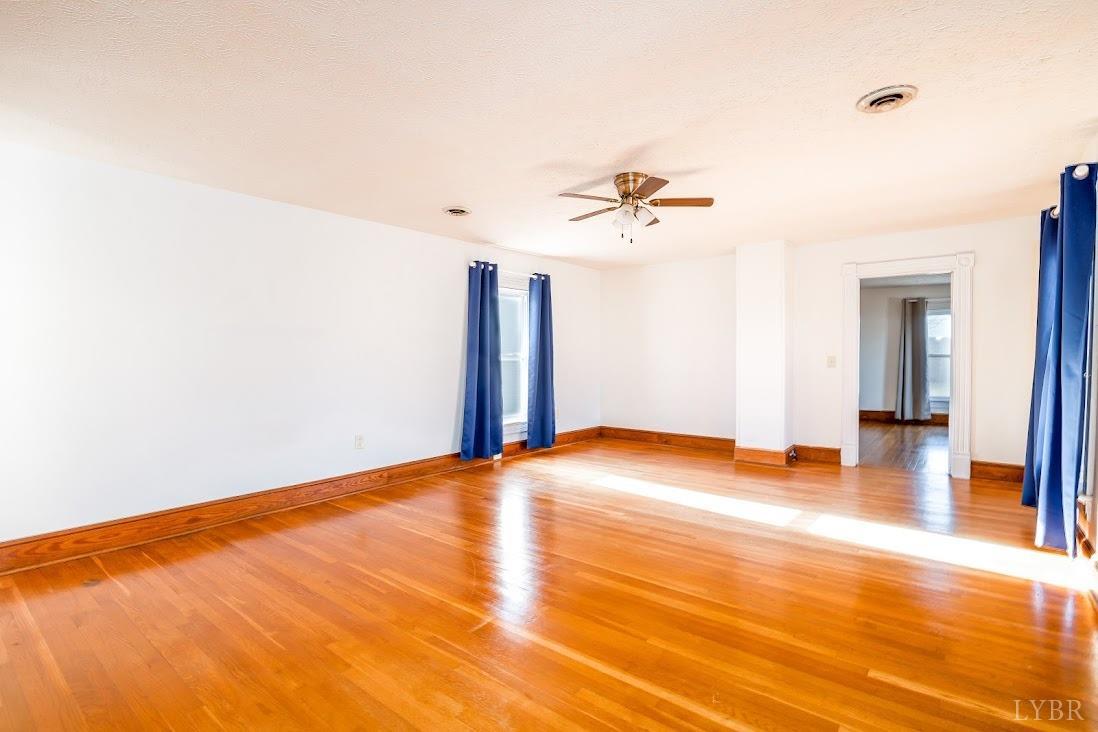 3655 Lowry Road Goode, VA 24556 - Photo 31 of 46 a view of empty room with wooden floor