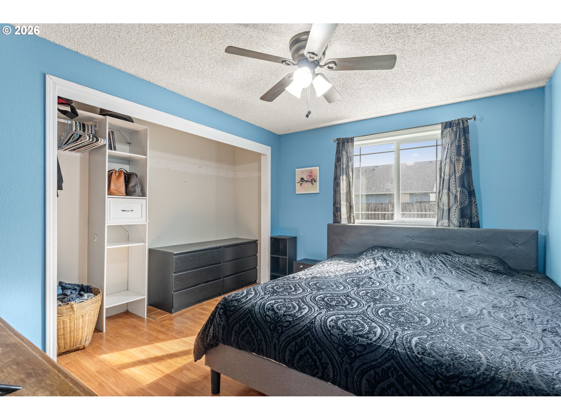 402 Clover Street Aumsville, OR 97325 - Photo 14 of 26 a bedroom with a bed and a large window