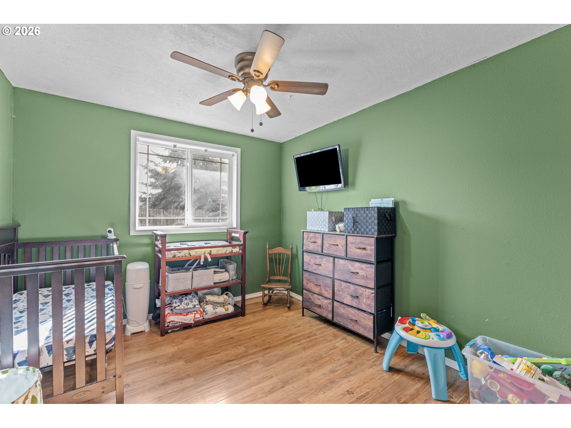 402 Clover Street Aumsville, OR 97325 - Photo 15 of 26 a living room with furniture and a flat screen tv