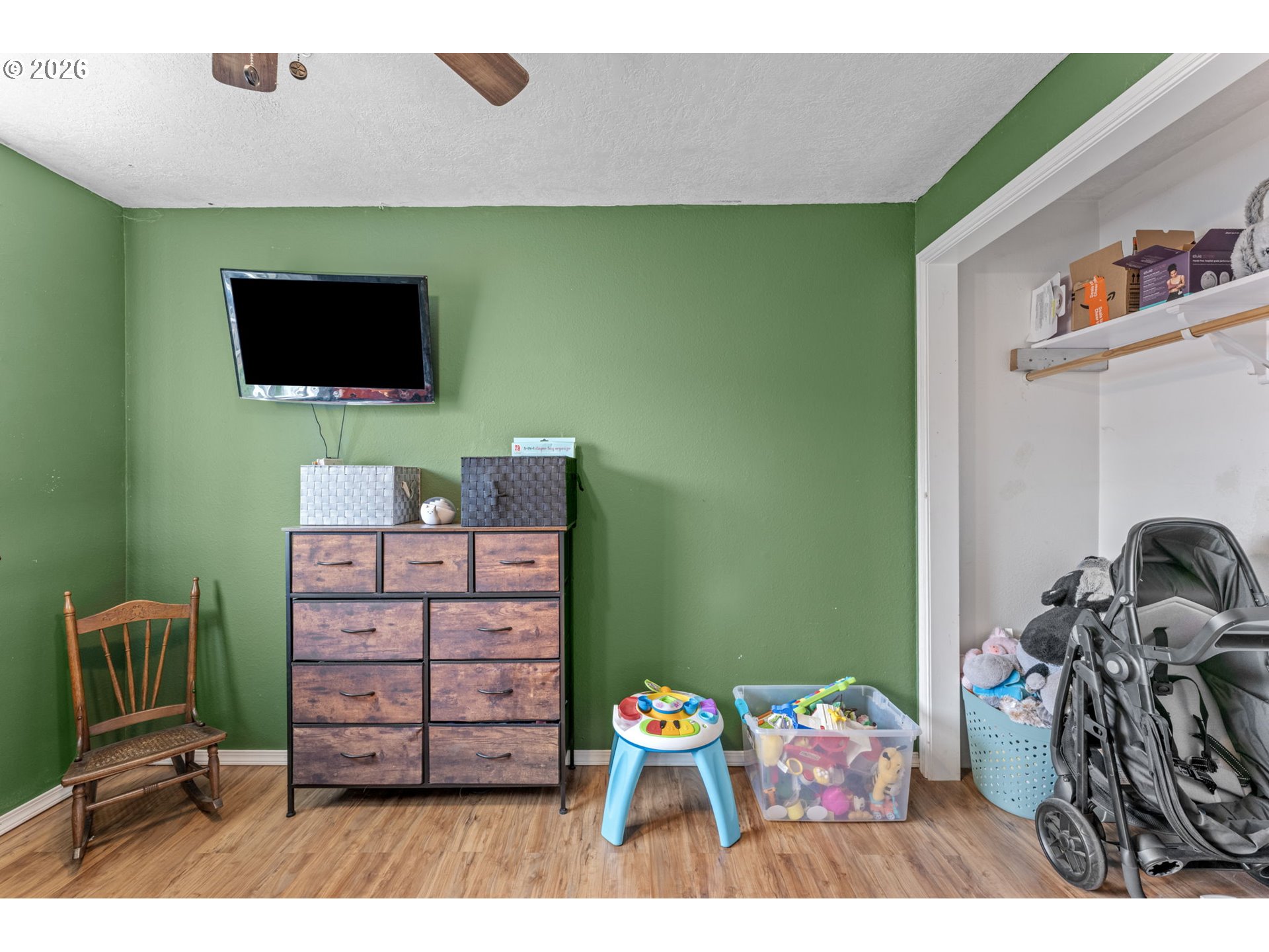 402 Clover Street Aumsville, OR 97325 - Photo 16 of 26 a living room with furniture and a flat screen tv