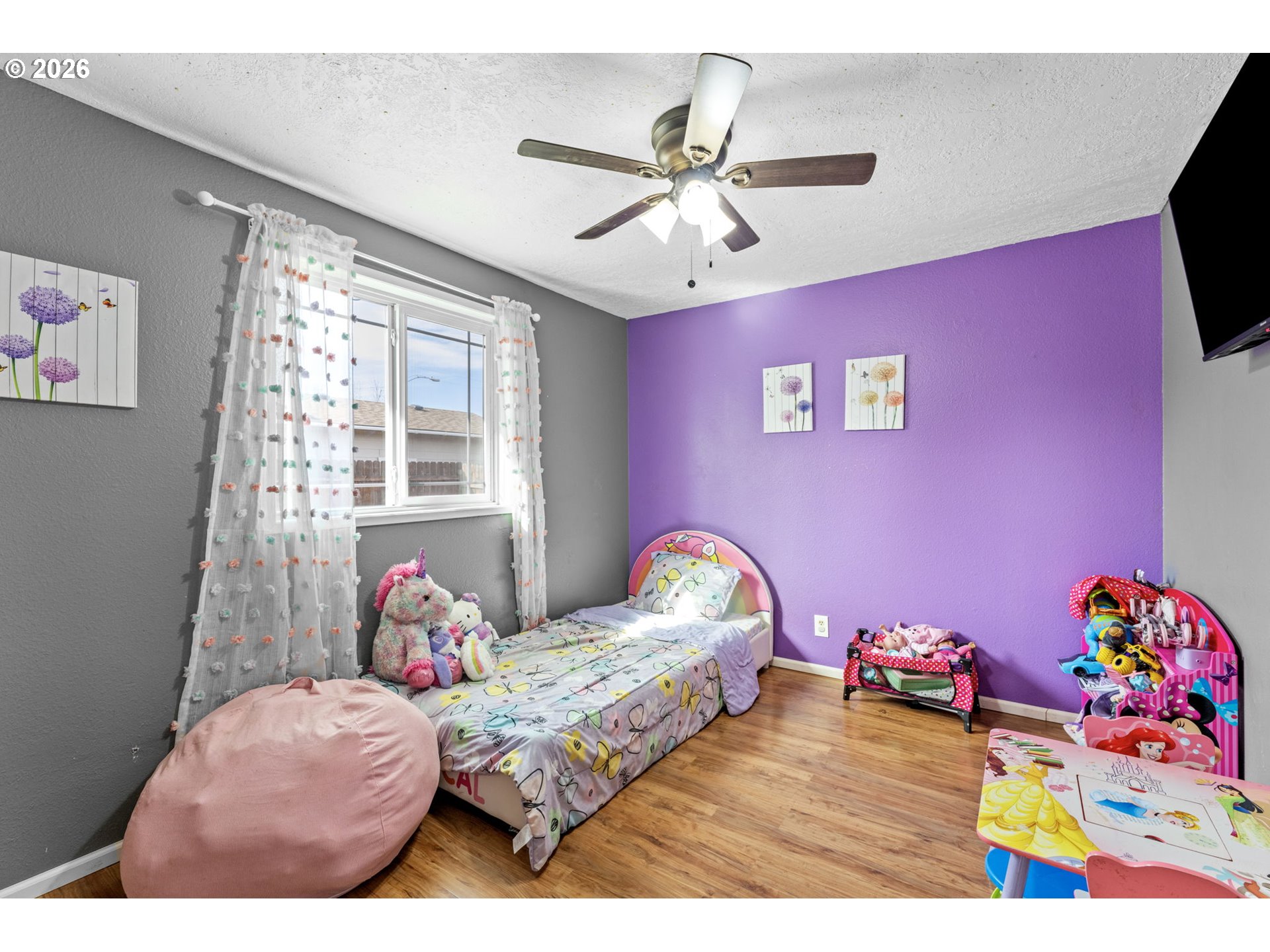 402 Clover Street Aumsville, OR 97325 - Photo 17 of 26 a bedroom with a bed and wooden floor