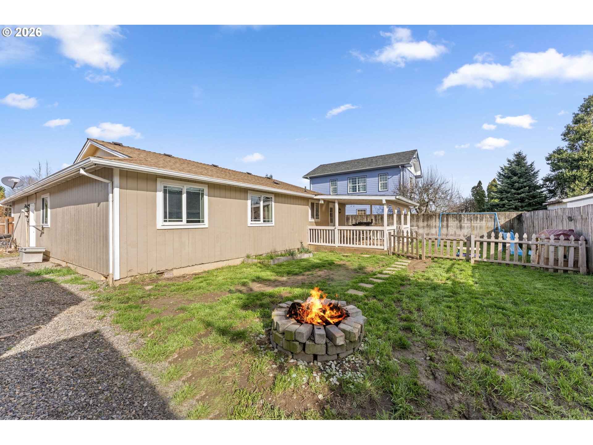 402 Clover Street Aumsville, OR 97325 - Photo 22 of 26 a view of backyard of house with deck and outdoor seating