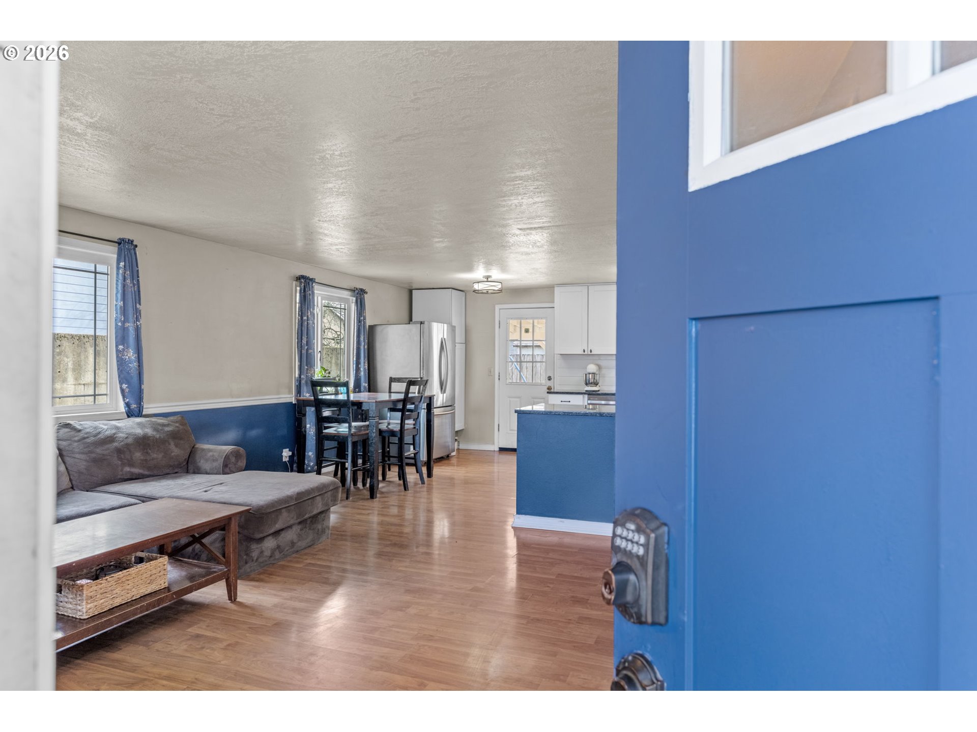 402 Clover Street Aumsville, OR 97325 - Photo 3 of 26 a living room with furniture and kitchen view