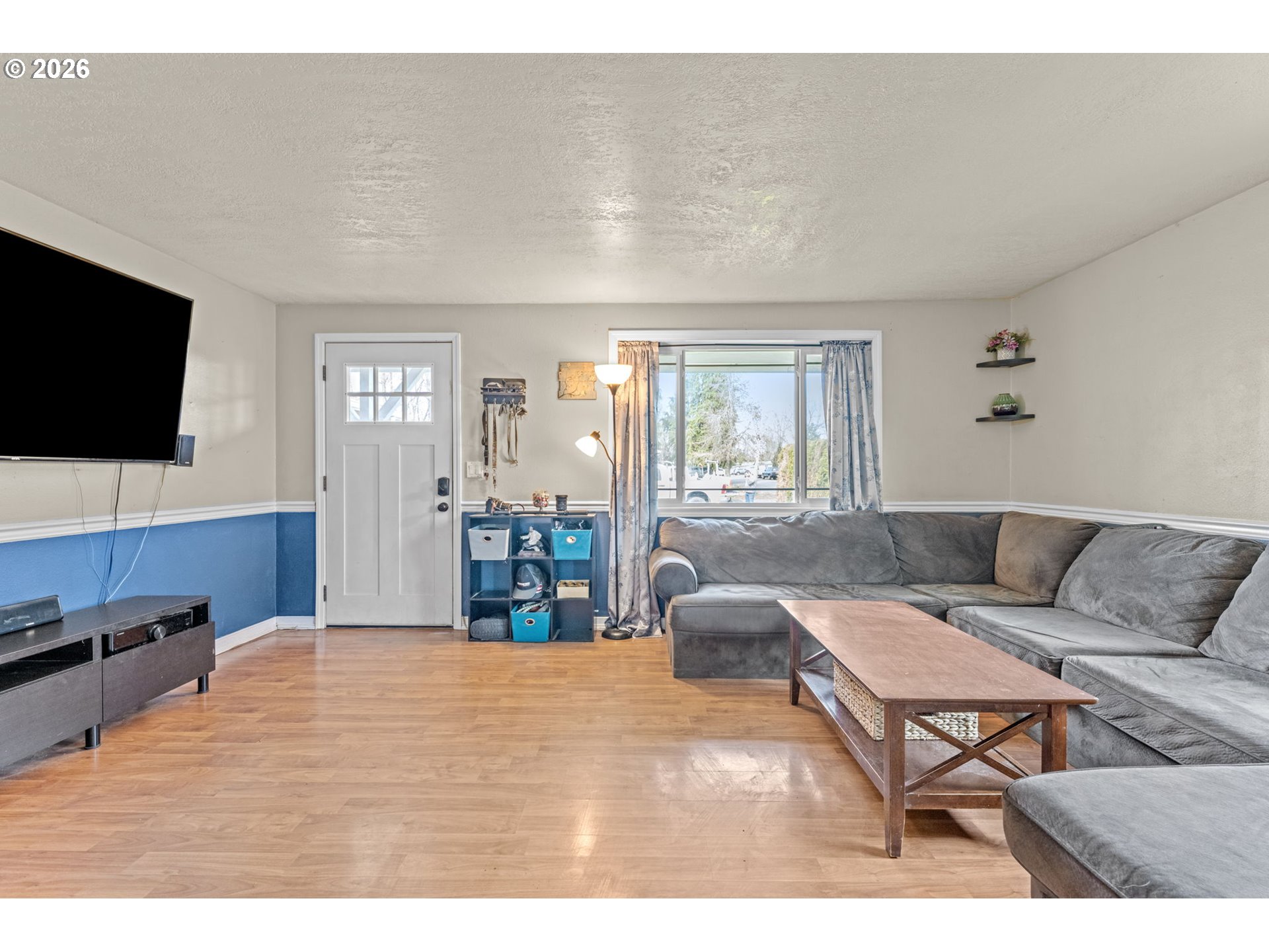 402 Clover Street Aumsville, OR 97325 - Photo 5 of 26 a living room with furniture and a flat screen tv