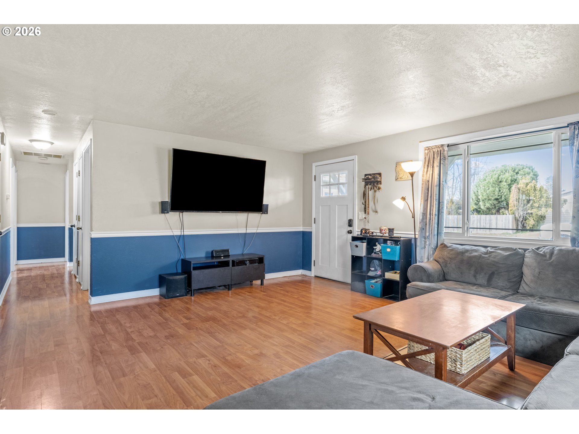 402 Clover Street Aumsville, OR 97325 - Photo 6 of 26 a living room with furniture and a flat screen tv