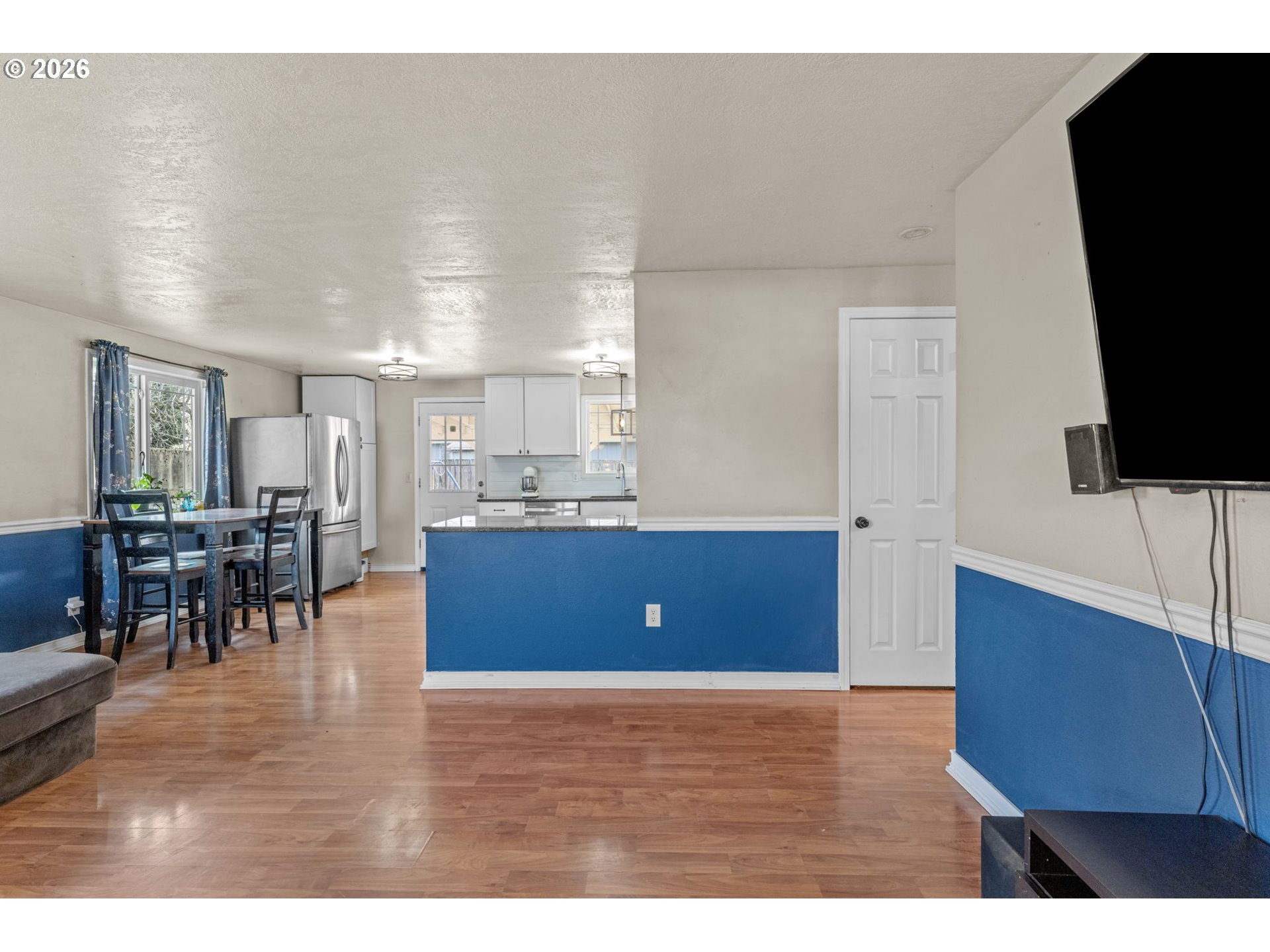 402 Clover Street Aumsville, OR 97325 - Photo 7 of 26 a living room with furniture and a flat screen tv