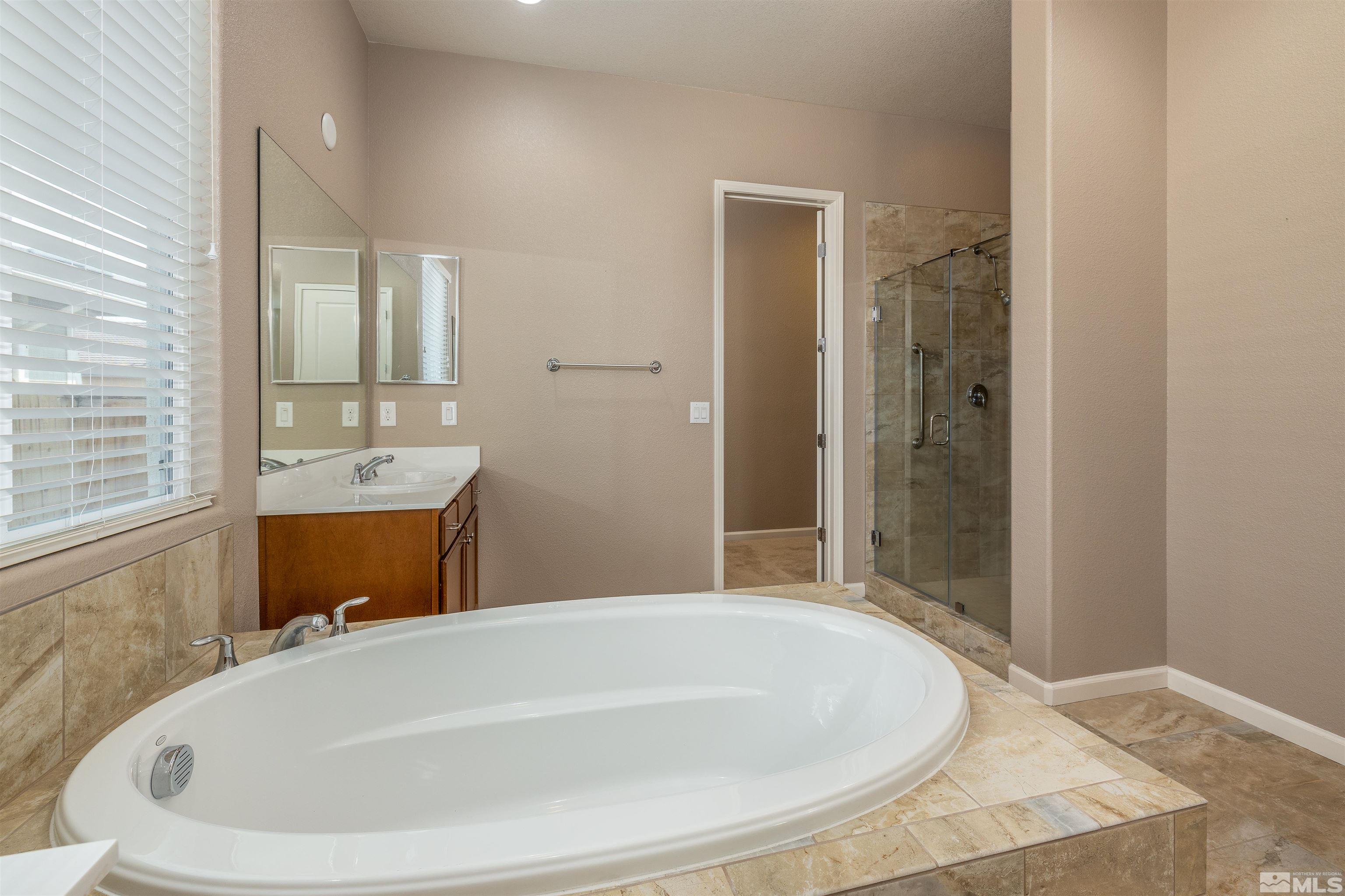 2113 Gregorgio Reno, NV 89521 - Photo 18 of 27 a bathroom with a tub and shower