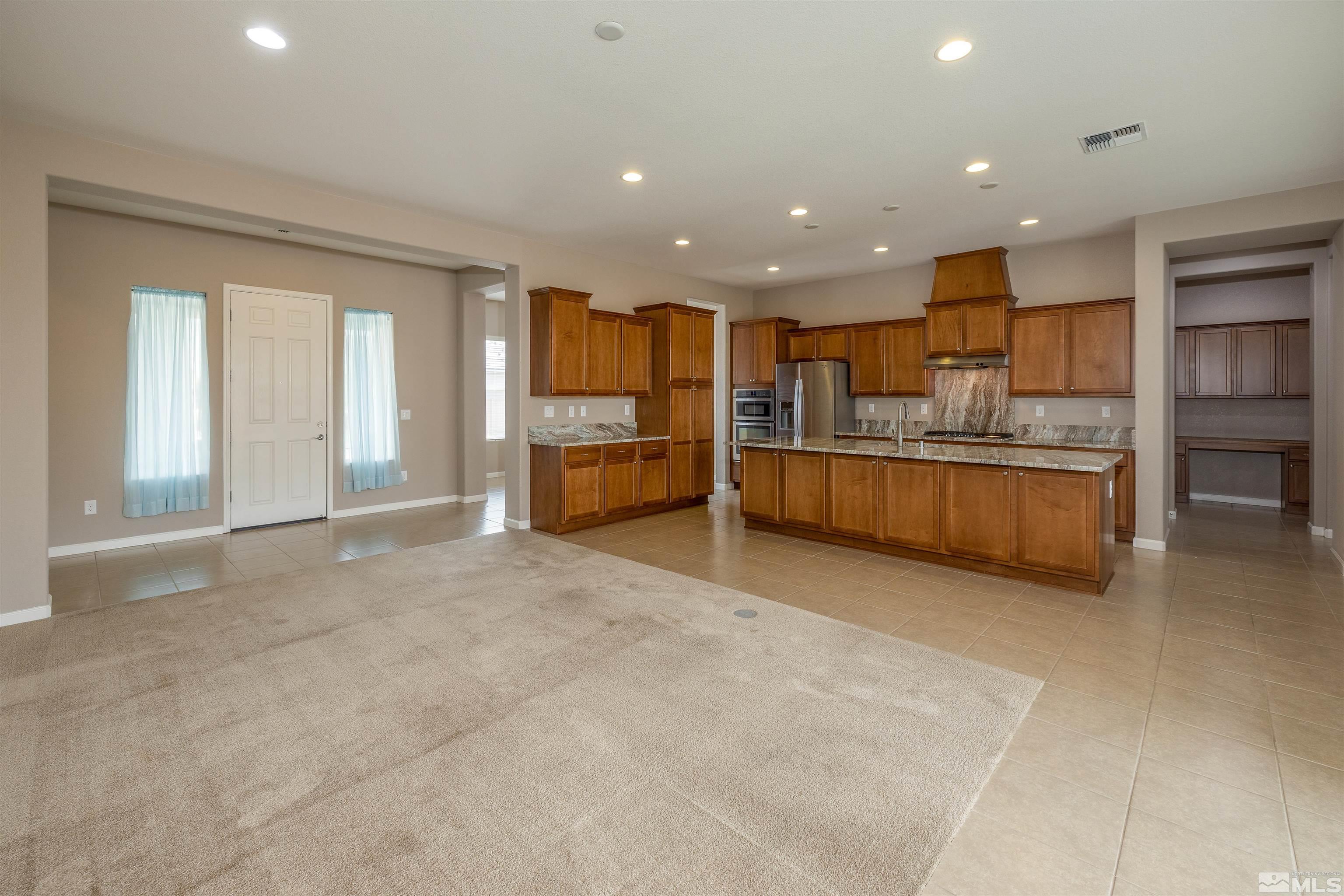 2113 Gregorgio Reno, NV 89521 - Photo 4 of 27 a view of kitchen and refrigerator cabinets
