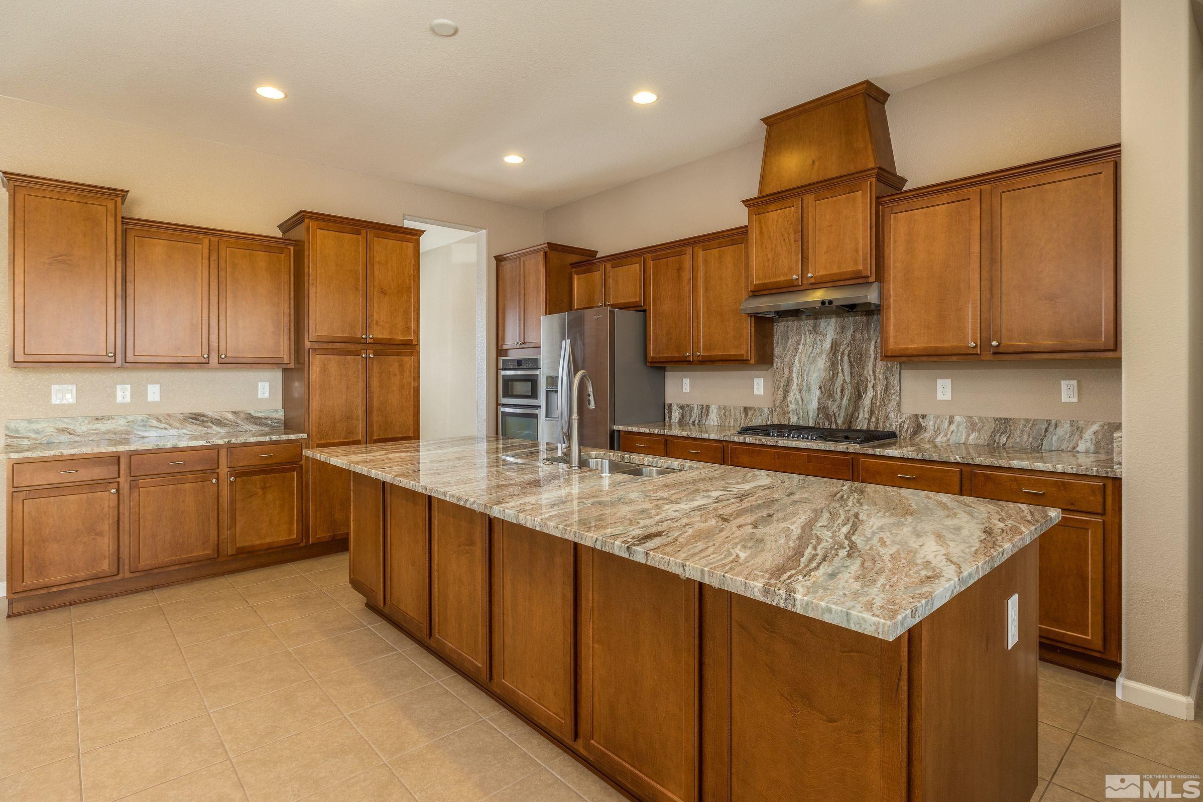 2113 Gregorgio Reno, NV 89521 - Photo 7 of 27 a kitchen with a sink refrigerator and cabinets