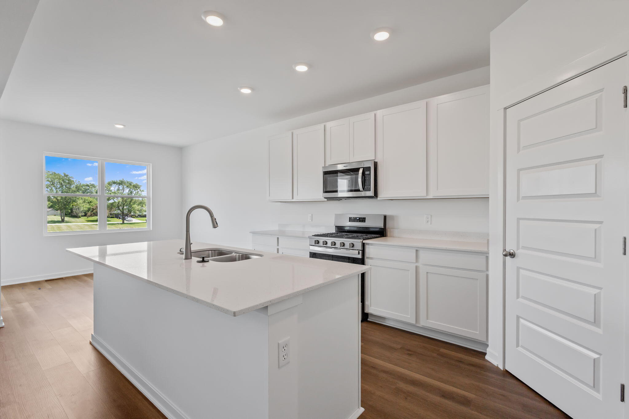 10650 Morse Place Crown Point, IN 46307 - Photo 4 of 15 a kitchen with white cabinets and appliances