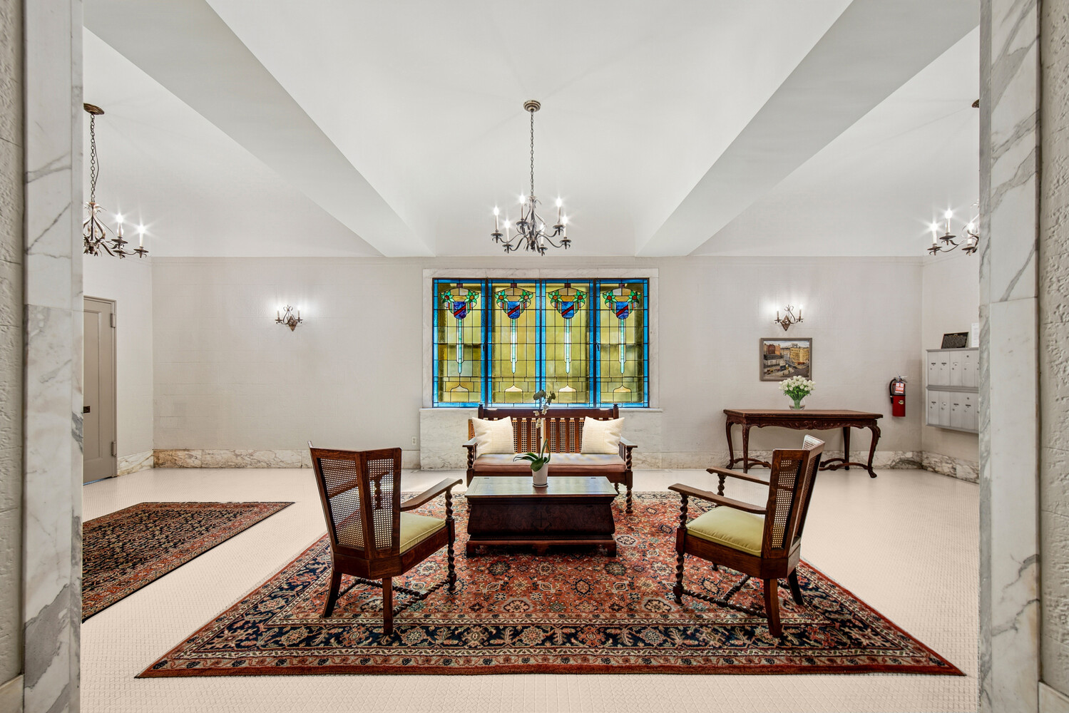 565 West 169th Street, Unit 3A Manhattan, NY 10032 - Photo 8 of 11 a living room with furniture a window and a chandelier