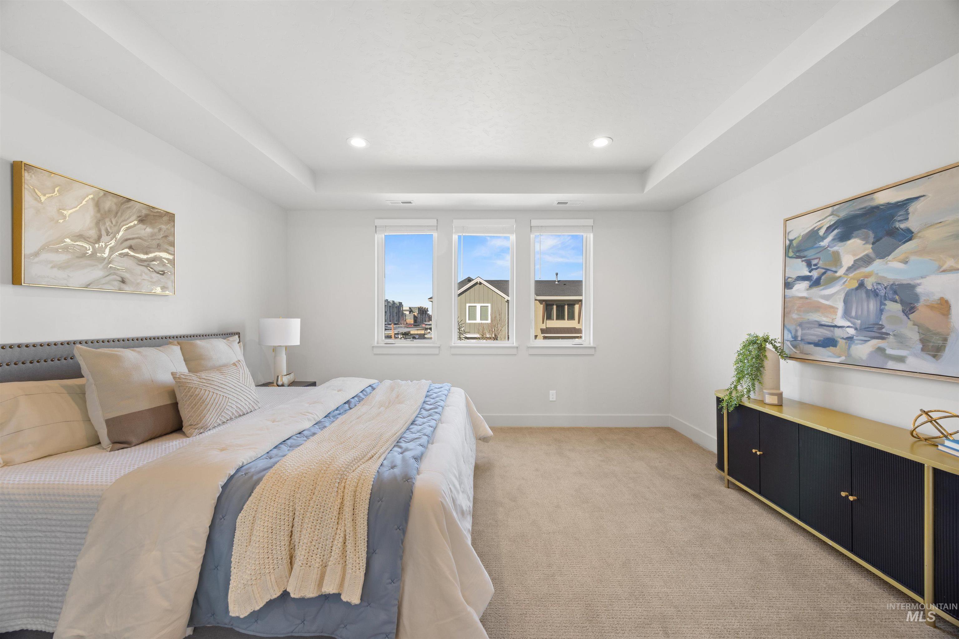 3282 South Millbrook Way Boise, ID 83716 - Photo 29 of 45 Bedroom with light carpet, a tray ceiling, and recessed lighting