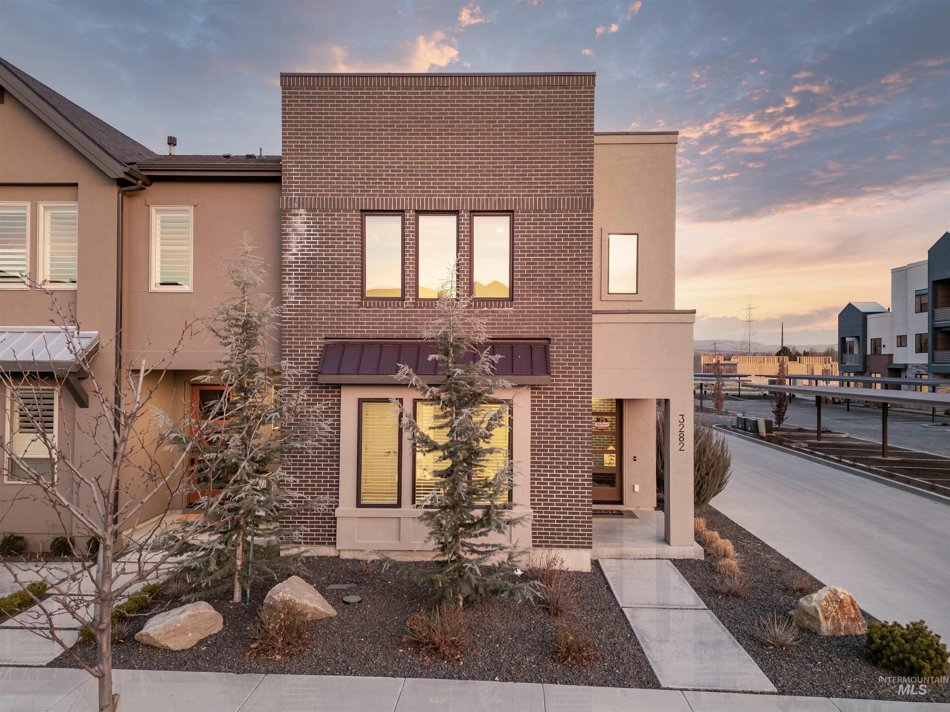 3282 South Millbrook Way Boise, ID 83716 - Photo 44 of 45 View of front of home with stucco siding, brick siding, and a standing seam roof