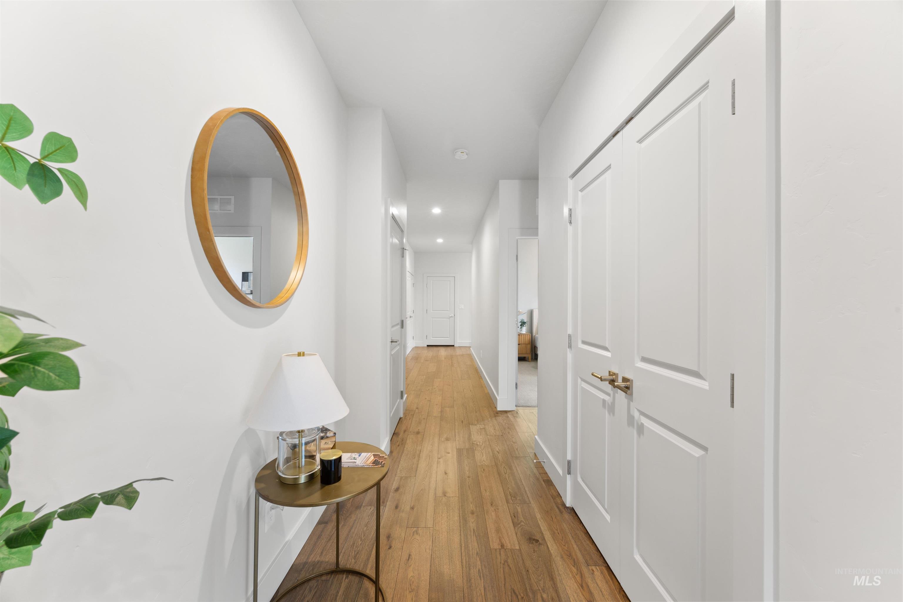 3282 South Millbrook Way Boise, ID 83716 - Photo 6 of 45 Hall with recessed lighting and light wood-type flooring