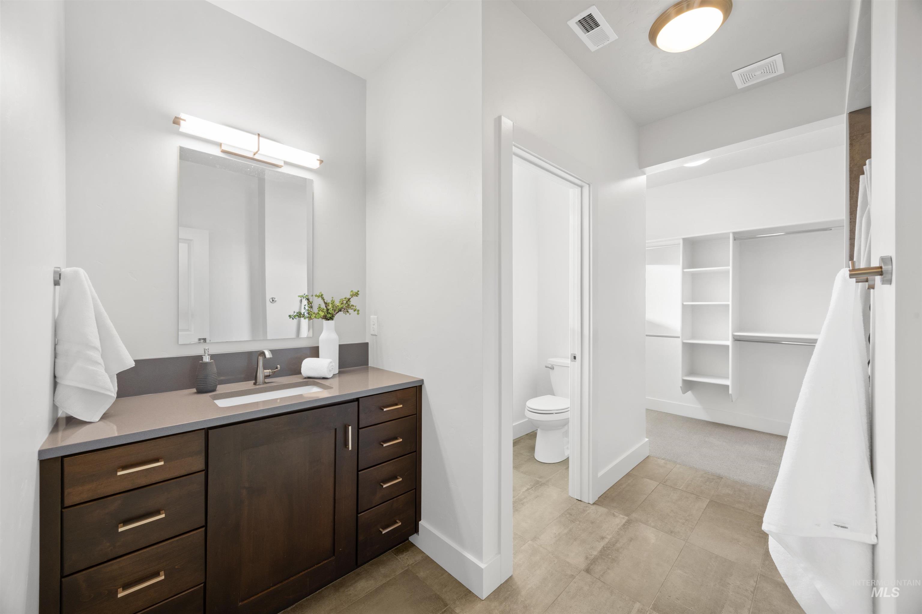 3282 South Millbrook Way Boise, ID 83716 - Photo 10 of 45 Full bathroom featuring vanity and a spacious closet