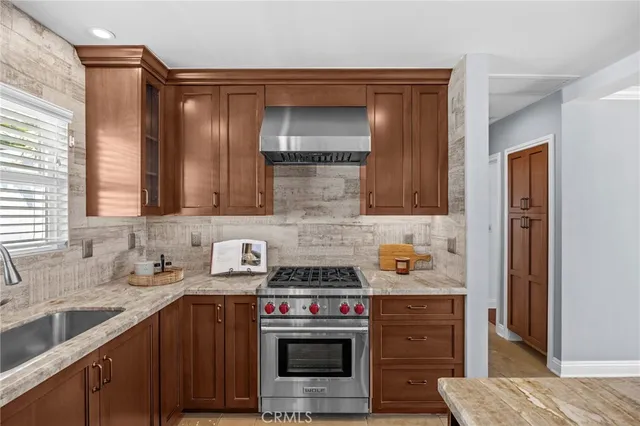 a kitchen with a stove and a sink